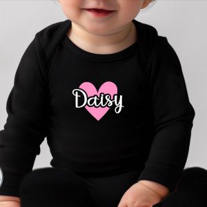Black personalised sleepsuit with pink heart and the name "Daisy" printed on the front.